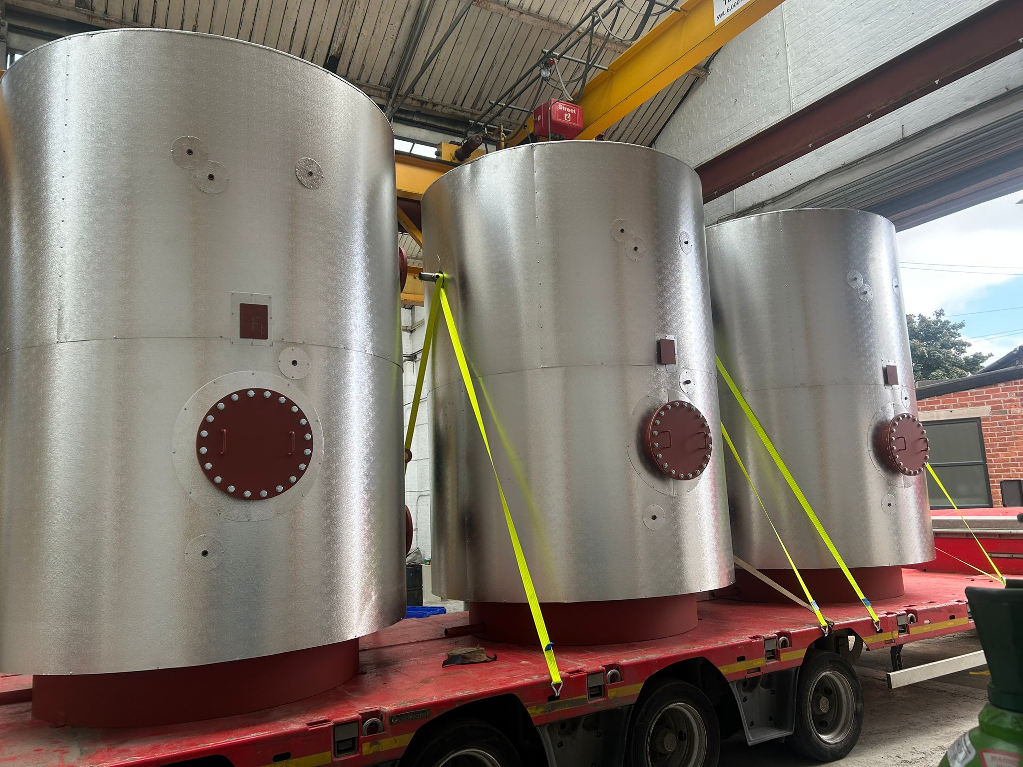 Stainless steel vessels loaded on a lorry ready for delivery