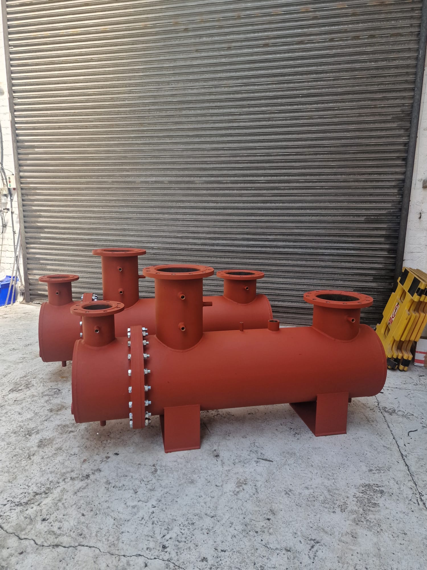 Red fabricated manifold vessel outside the R2 Fabrication workshop in Stalybridge